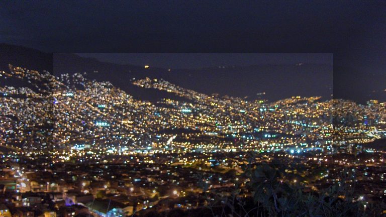 Medellin night skyline for Airbnb management fees guide